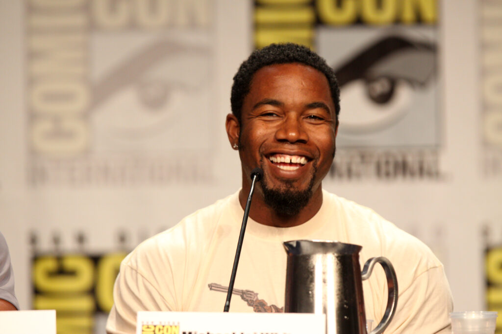 Movie Star Michael Jai White talking on a panel at a movie convention